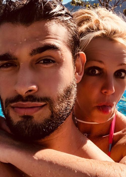 Sam Asghari and Britney Spears in a selfie while swimming in July 2018