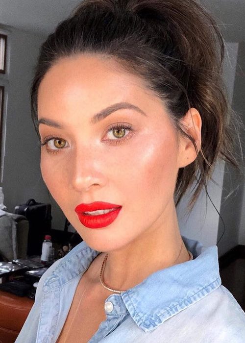 Olivia Munn showing her face after getting makeup done via Patrick Ta in December 2017