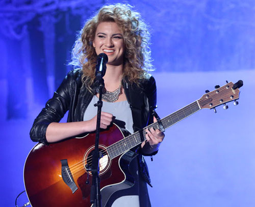 Tori Kelly playing guitar