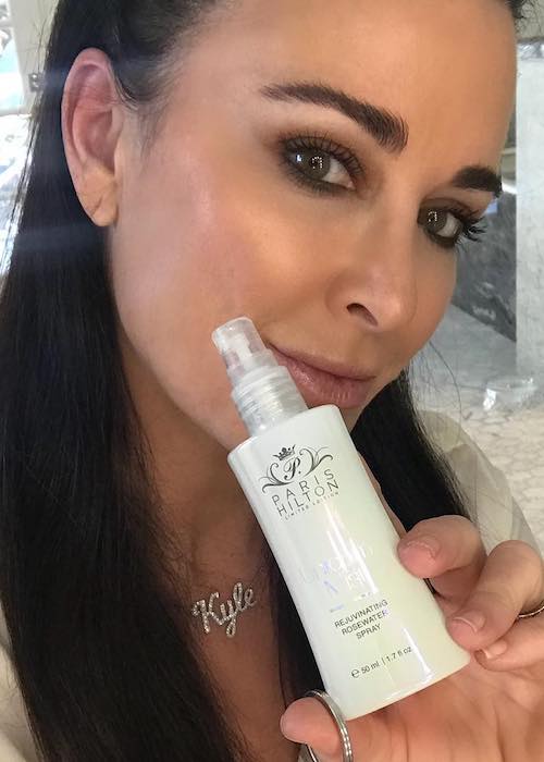 Kyle Richards showing Paris Hilton Unicorn Mist product in November 2017