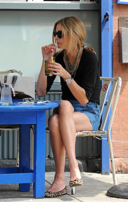 Olivia Palermo sipping a drink