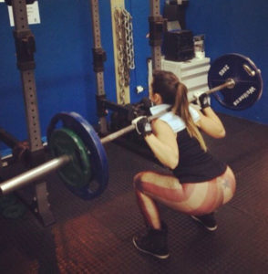 Alice Matos doing squats.