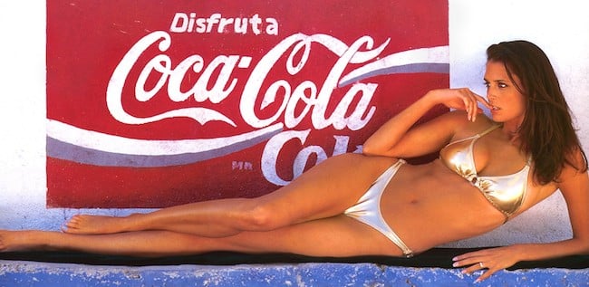 Stacey Williams in front of Coca Cola advertisement
