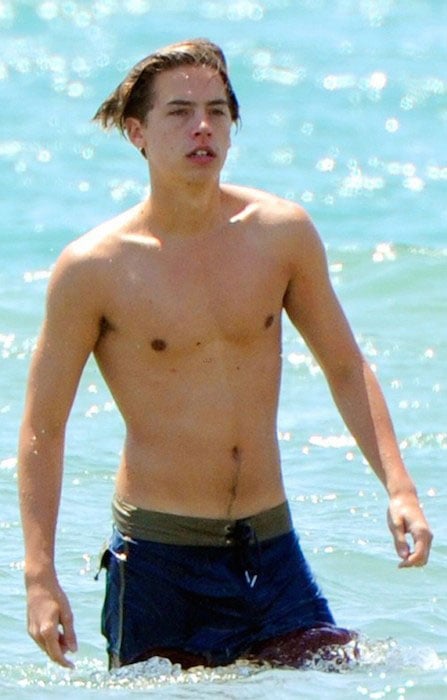 Cole Sprouse shirtless on an Italian Beach. 