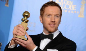 Damian Lewis poses with the Golden Globe 2013 Award for "Best Performance by an Actor in a Television Series."