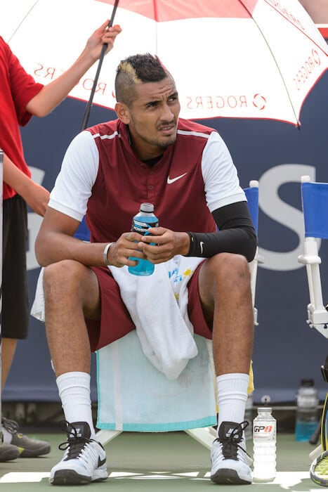 Nick Kyrgios taking a break during the match against John Isner at Rogers Cup