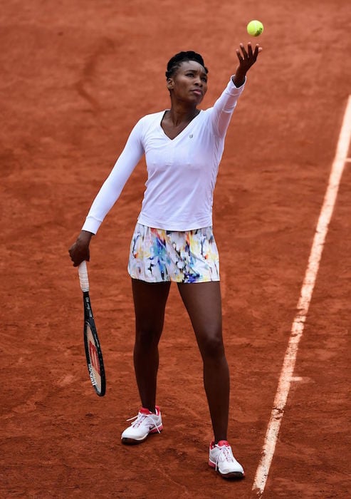 Venus Williams servicing during round 2 at 2014 French Open at Roland Garros