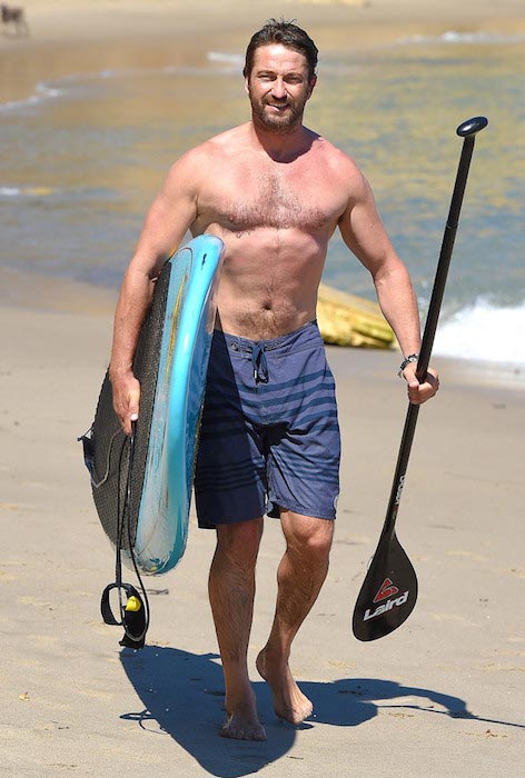 Gerard Butler shirtless at a beach in Malibu