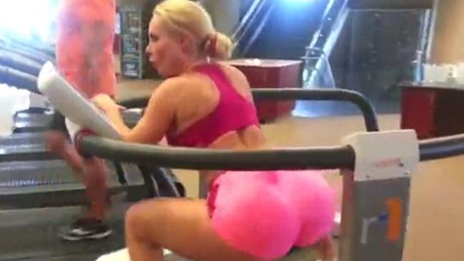Coco Austin in gym doing workout