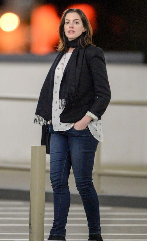 Anne Hathaway shows off her baby bump out to dinner with Adam Shulman in Century City in December 2015