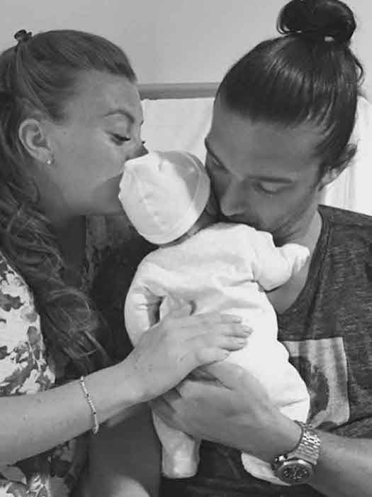 Billi Mucklow and Andy Carroll with son