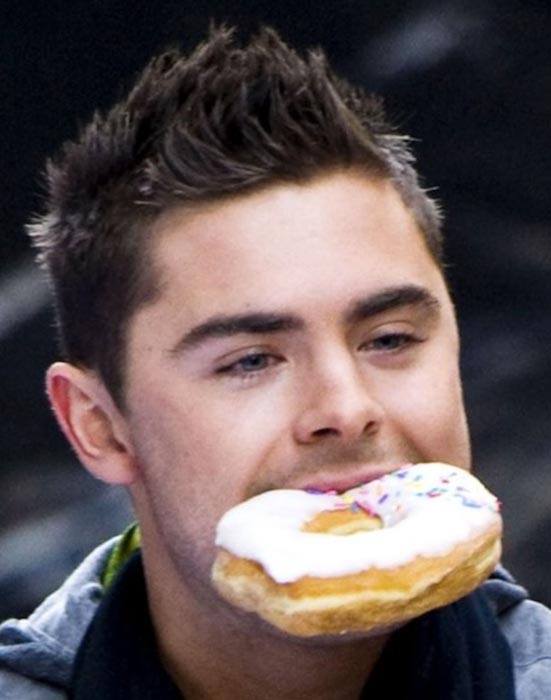 Zac Efron eating a bagel as a cheat food