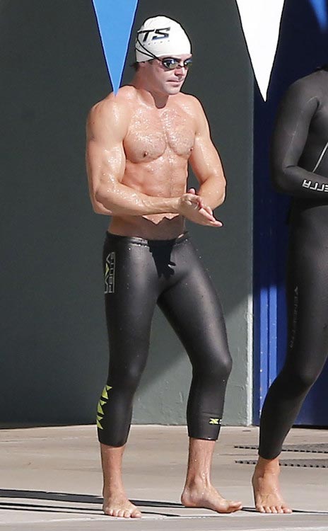 Zac Efron showcases his chiseled chest during a swimming lesson for Baywatch role