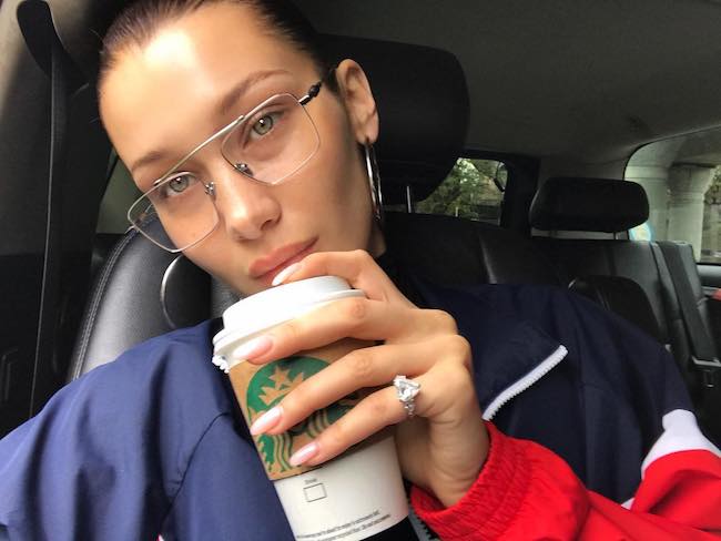 Bella Hadid in a car selfie in October 2017 having Starbucks coffee