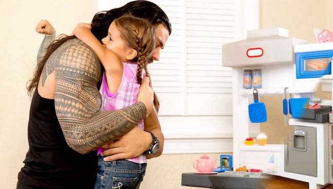 Roman Reigns with his daughter