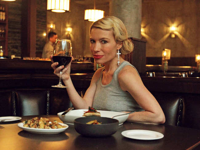 Tracy Anderson enjoying food with a drink