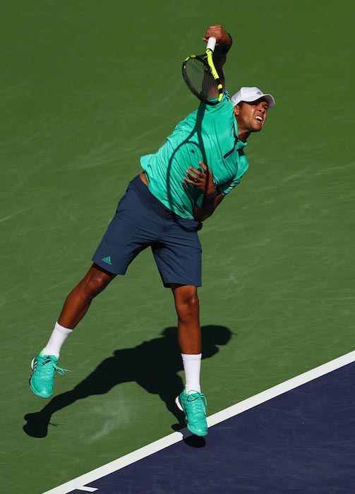 Jo-Wilfried Tsonga serving against Novak Djokovic in a match of the BNP Paribas Open on March 18, 2016