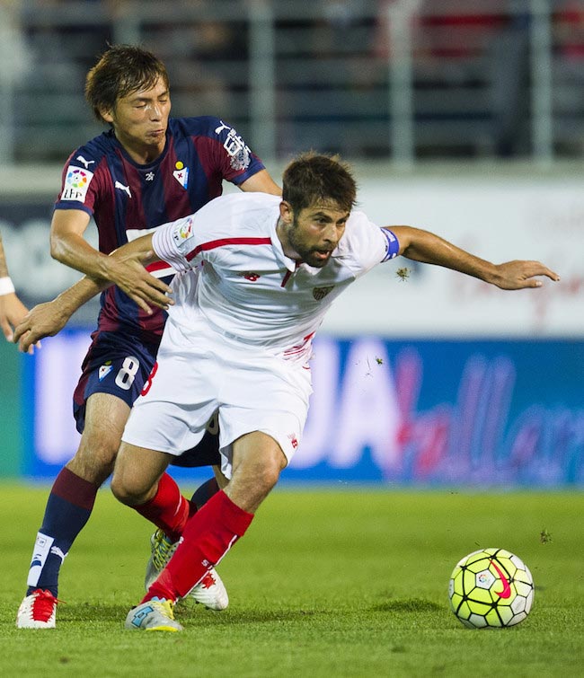 Jorge Andujar Moreno in a duel with Takashi Inui of Eibar in a match between Sevilla FC and SD Eibar on October 17, 2015