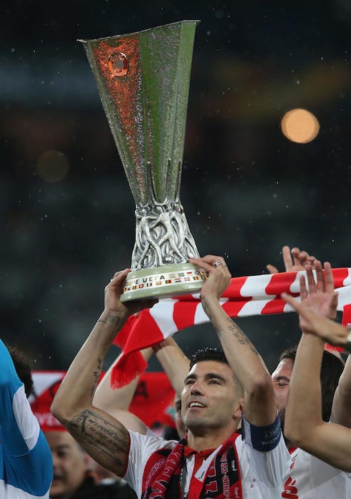 Jose Antonio Reyes with the trophy after winning the 2016 UEFA Europa League with Sevilla FC on May 18, 2016