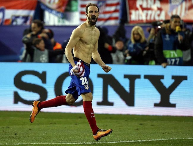 Juanfran celebrates after scoring a goal for his team during a Primera Division match.