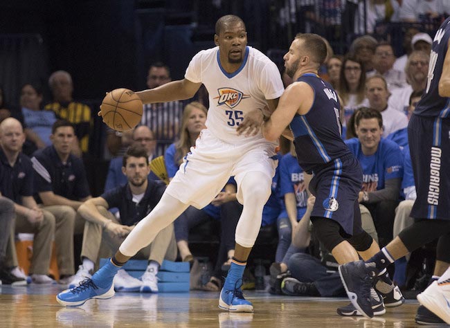 Kevin Durant in a duel with J.J. Barea from Dallas Mavericks in a game one of the Western Conference Quarterfinals of the 2016 NBA Playoff on April 16, 2016