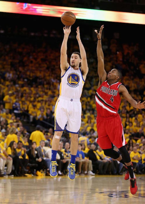 Klay Thompson shooting over Maurice Harkless in a match of the Western Conference Semifinals between Golden State Warrior and Portland Trail Blazers at Oracle Arena in California on May 11, 2016