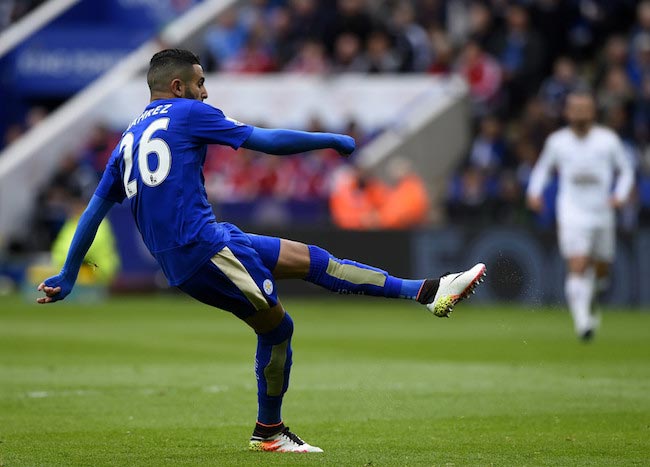 Riyad Mahrez scoring a goal in a match against Swansea City on April 24, 2016 in Leicester, United Kingdom