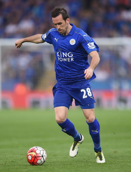 Christian Fuchs handling the ball during a match between Leicester City and Everton on May 7, 2016