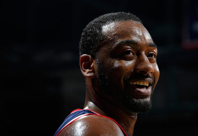 John Wall smiles after a 117-102 victory over Atlanta Hawks on March 21, 2016