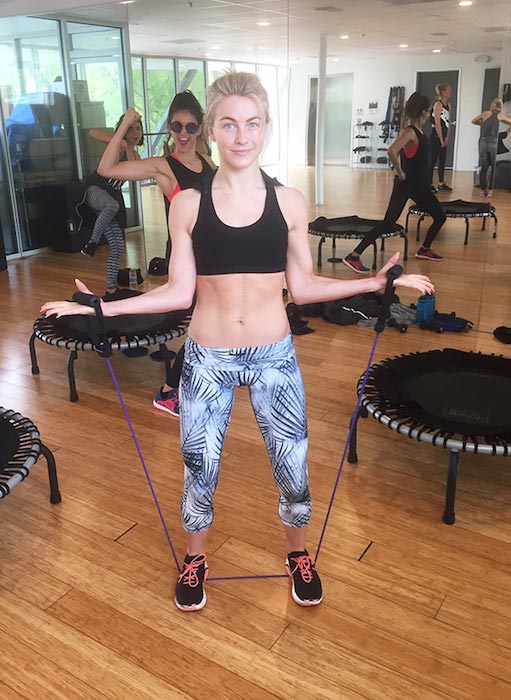 Julianne Hough working out her biceps with resistance band