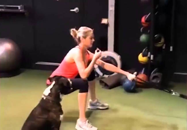 Kate Upton eating a doughnut while working out