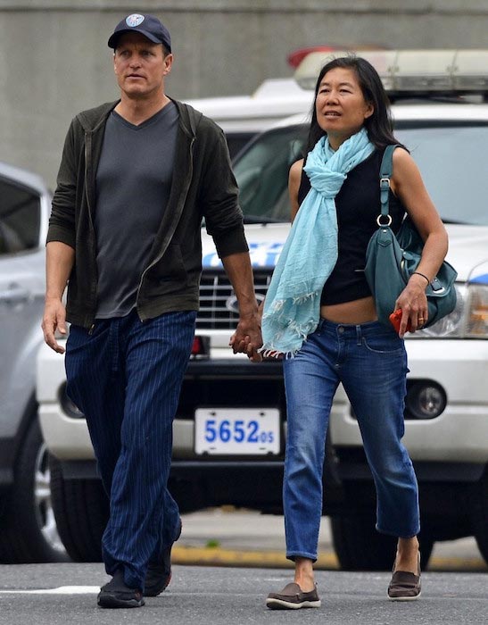 Woody Harrelson walking hand in hand with wife Laura Louie in New York City on May 22, 2013