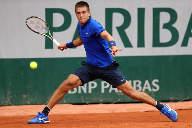 Borna Coric returns the ball against Bernard Tomic at 2016 French Open on May 26, 2016 in Paris