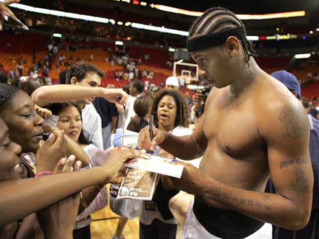 Carmelo Anthony shirtless signing autographs after a game with the Denver Nuggets