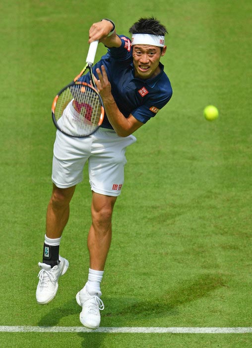 Kei Nishikori serves against Lucas Pouille in a match at Gerry Weber Open on June 13, 2016 in Halle, Germany