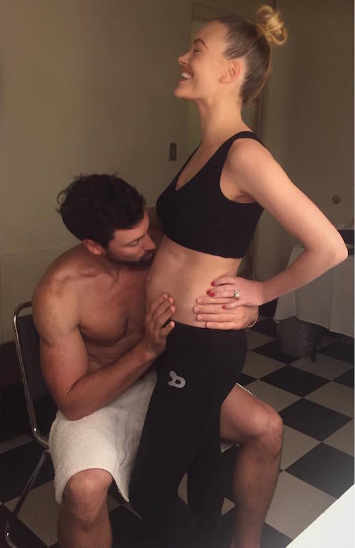 Maksim Chmerkovskiy checking Peta Murgatroyd's baby bump