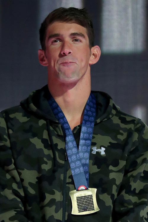 Michael Phelps during a medal ceremony for the Men’s 100 Meter Butterfly competition at the 2016 USA Olympic Team Swimming Testing