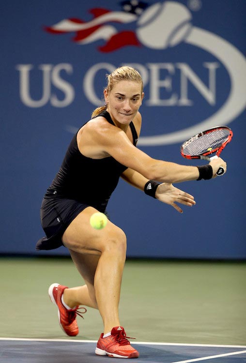 Timea Babos plays slice shot against Samantha Stosur in a match of 2015 US Open in NYC