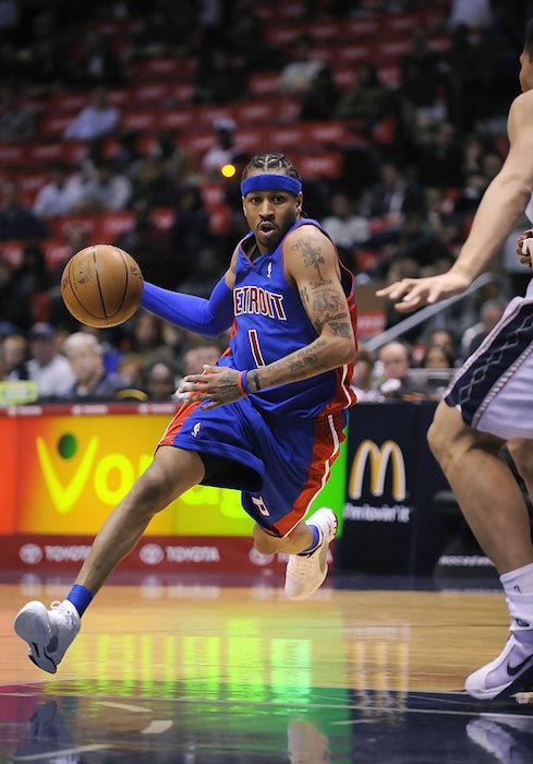 Allen Iverson in action against Brook Lopez during a match between the Detroit Pistons and New Jersey Nets on November 7, 2008