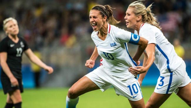 Carli Lloyd expressing her happiness while playing football