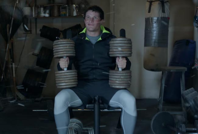 Luke Kuechly lifts weights while playing a snow game in the latest Nike ad
