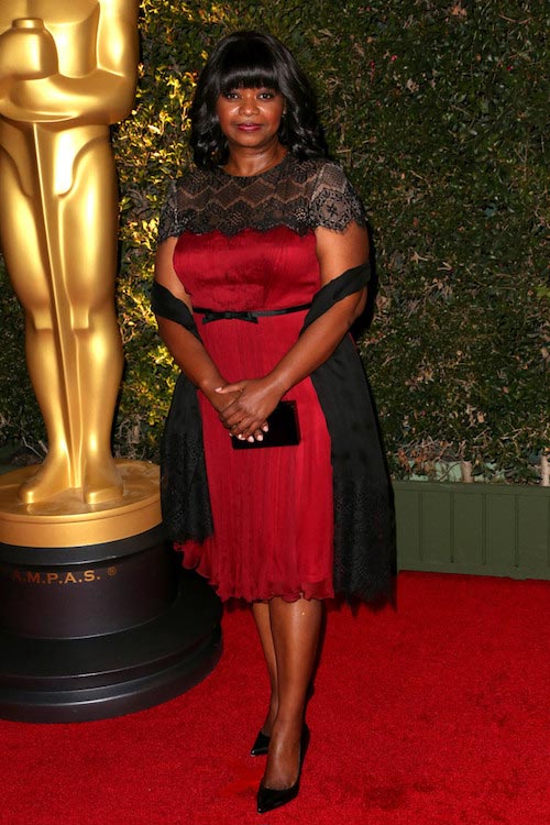 Octavia Spencer in a red cocktail dress during Governor Awards in November 2013