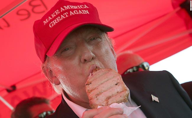 Donald Trump eats a pork chop on a stick while attending the Iowa State Fair in August 2016