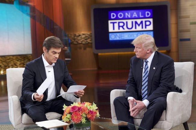 Dr Oz studying medical reports of Donald Trump