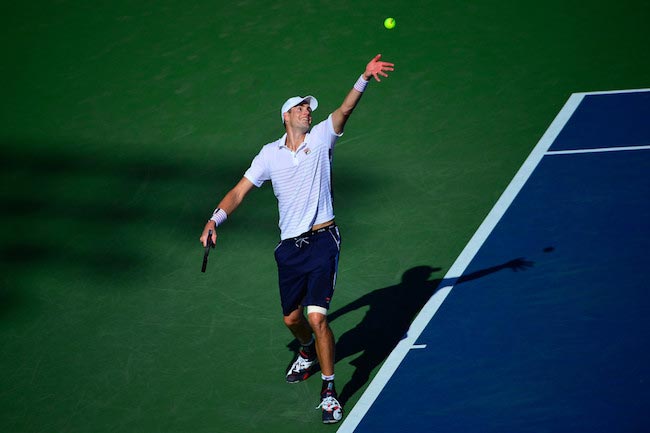 John Isner serves against Frances Tiafoe during 2016 US Open on August 29, 2016