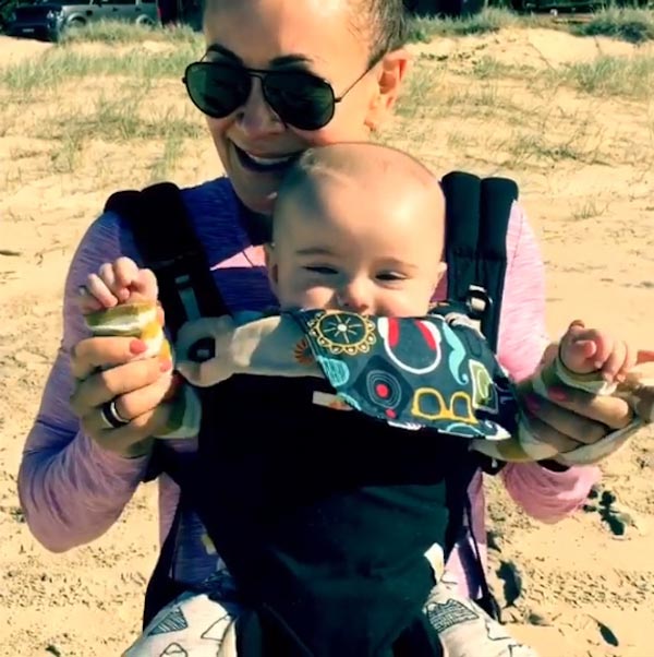 Michelle Bridges takes son Axel for a beach baby workout