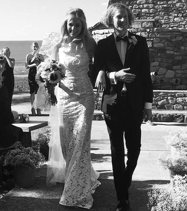 Bridget Malcolm walks down the aisle with husband Nathanial Hoho