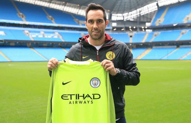 Claudio Bravo poses with the Manchester City jersey at his official unveiling at the English club on August 24, 2016