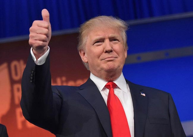 Donald Trump thumbs up sign public meeting supporters February 2015