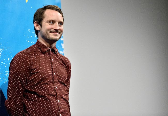 Elijah Wood smiles for the cameras during the screening of "The Trust" at the 2016 SXSW Music festival